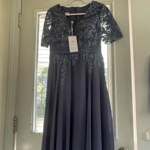 JJ House dress, size 6. Brand New w/tags attached. The color is called Stormy.
